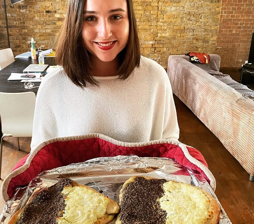 a woman holding baked lebanese breakfast