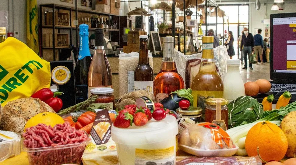 table with food and drinks on it at a market